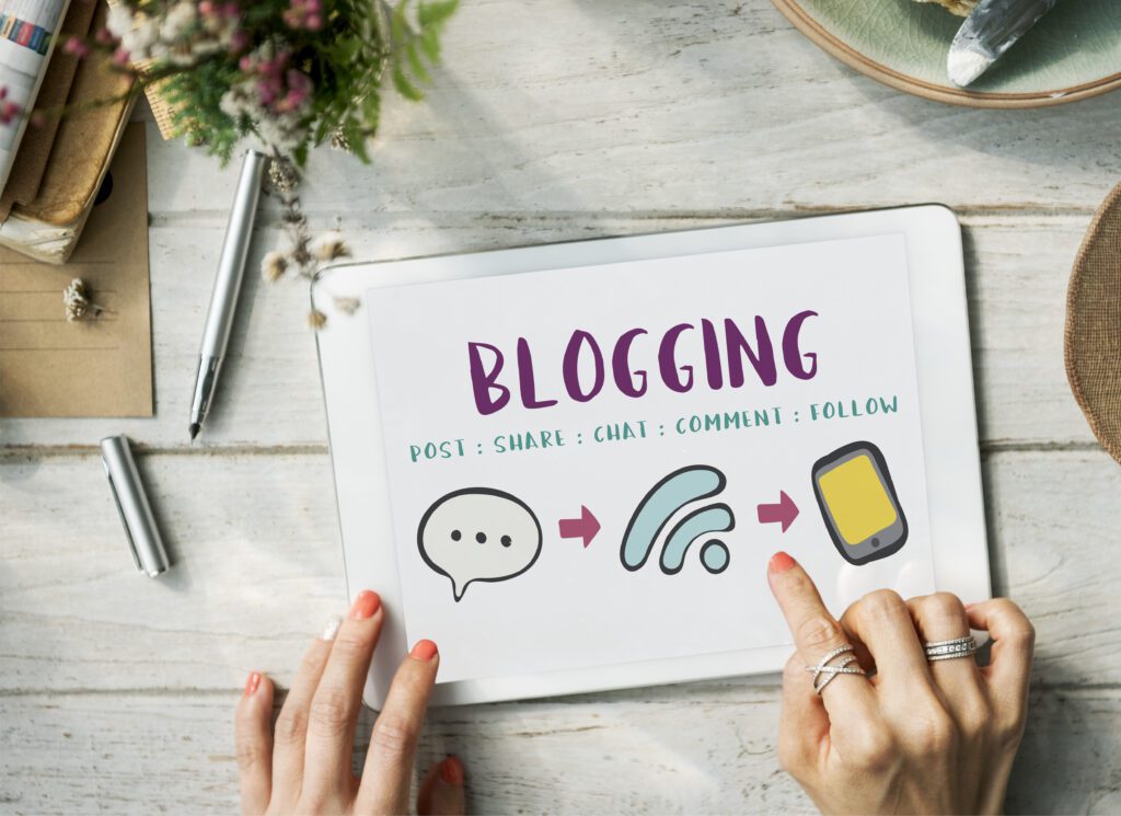 Blogging is written on a small white board